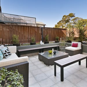 backyard patio with secluded wooden fence      